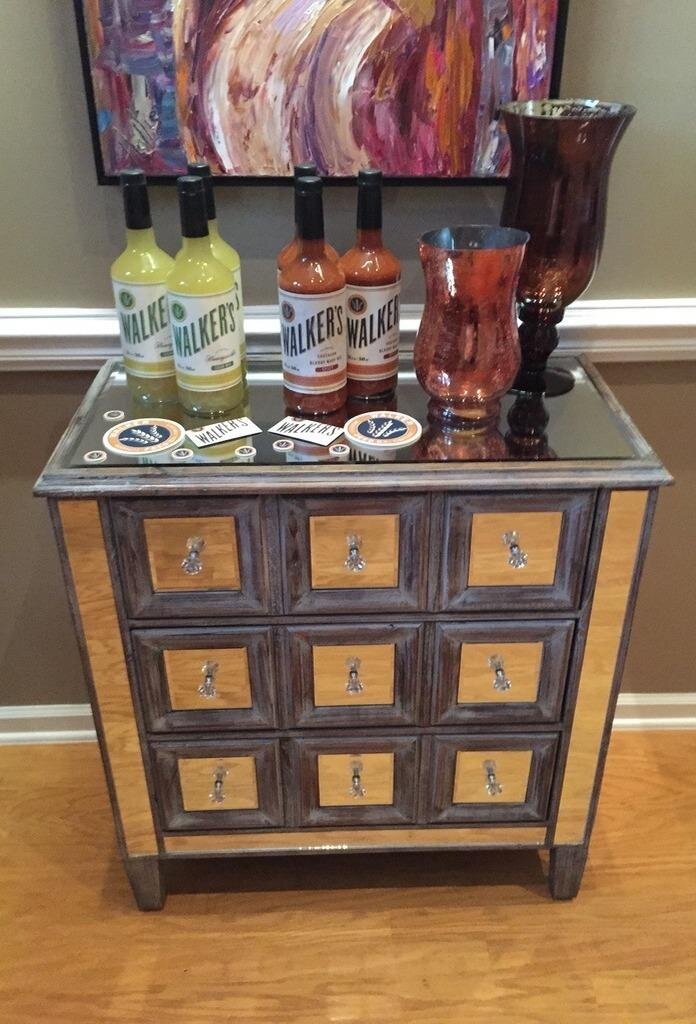 Bottles of Walker's Bloody Mary Mix displayed at a Painting Party Events venue.
