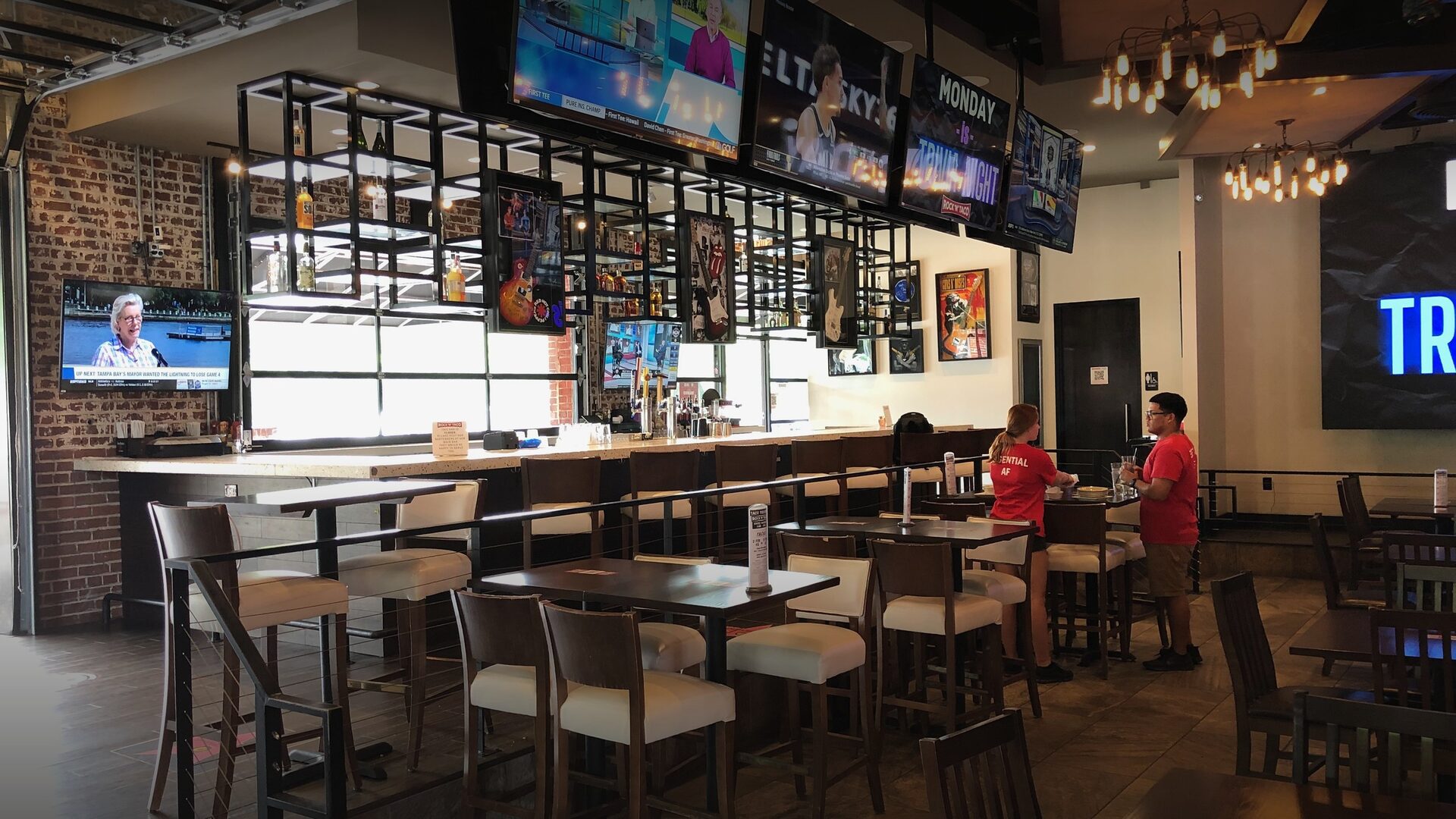 The finished Rock 'N' Taco dining room, built around the entertainment platform rather than a wall of televisions.