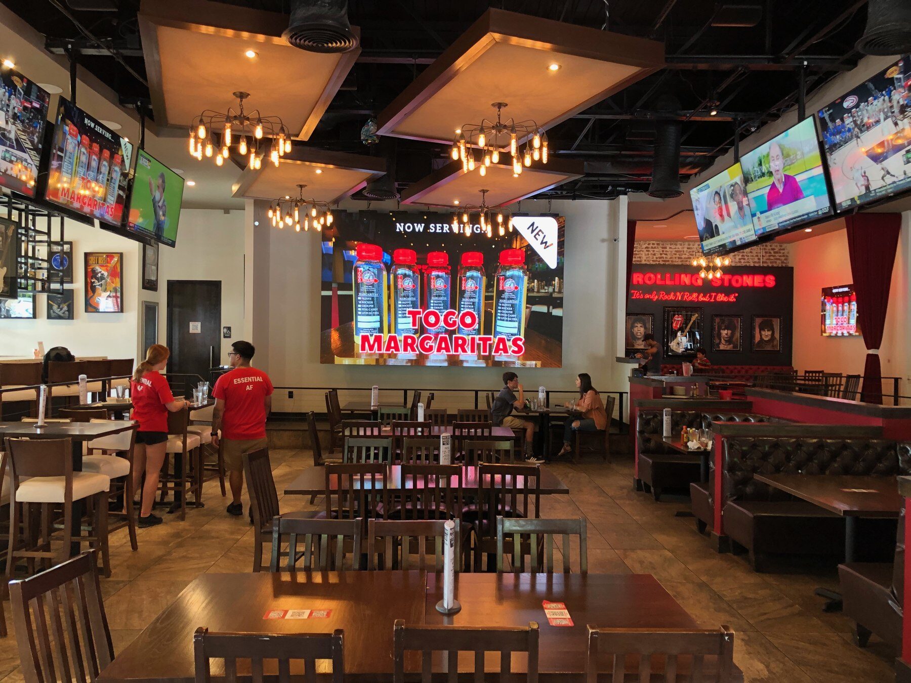 Rock 'N' Taco large-format LED video wall above the bar.