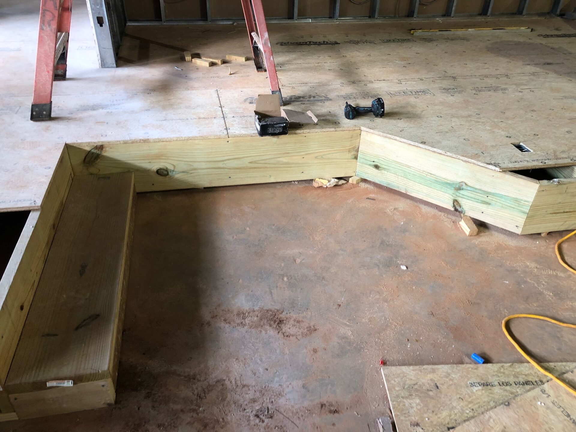 Steel framing and rough construction of the stage platform before finishing.